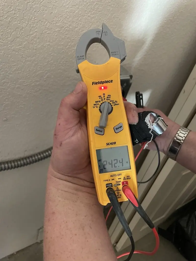 Voltage testing with clamp meter during Outlet Installation in West Modesto